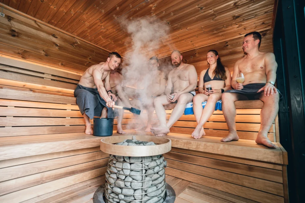 people enjoying Löyly in a Finnish sauna