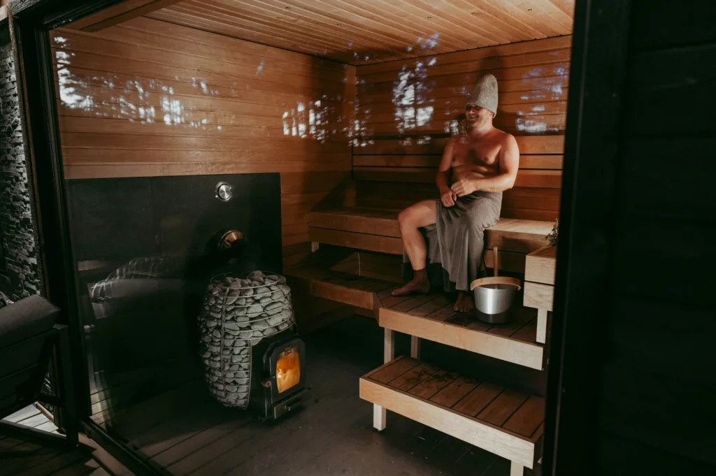 a person experiencing mild headache in sauna