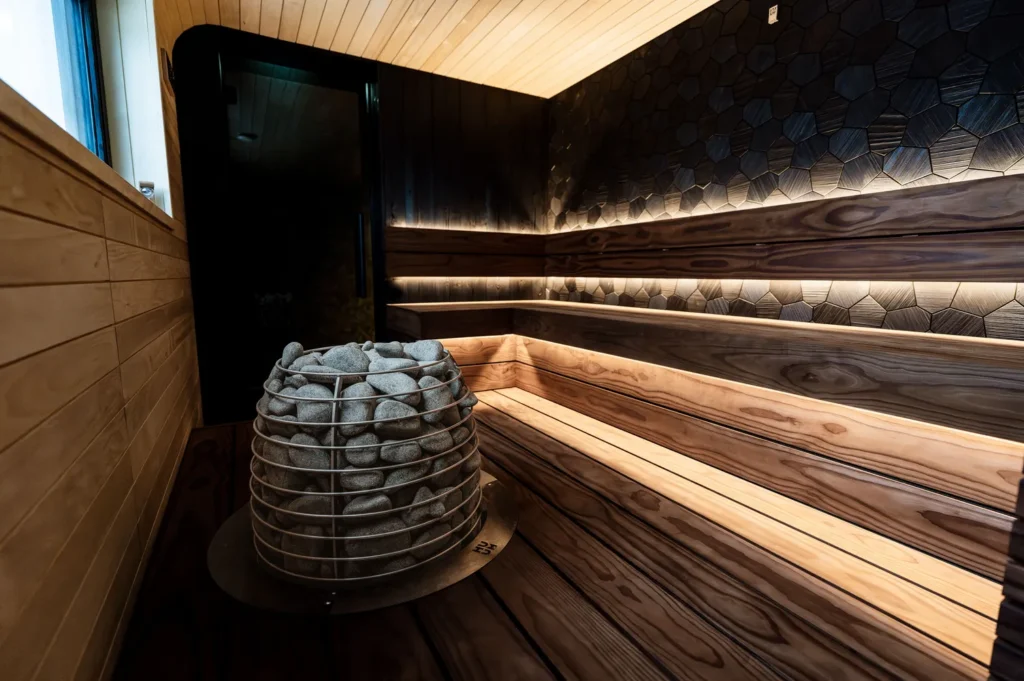 a sauna room with electric sauna