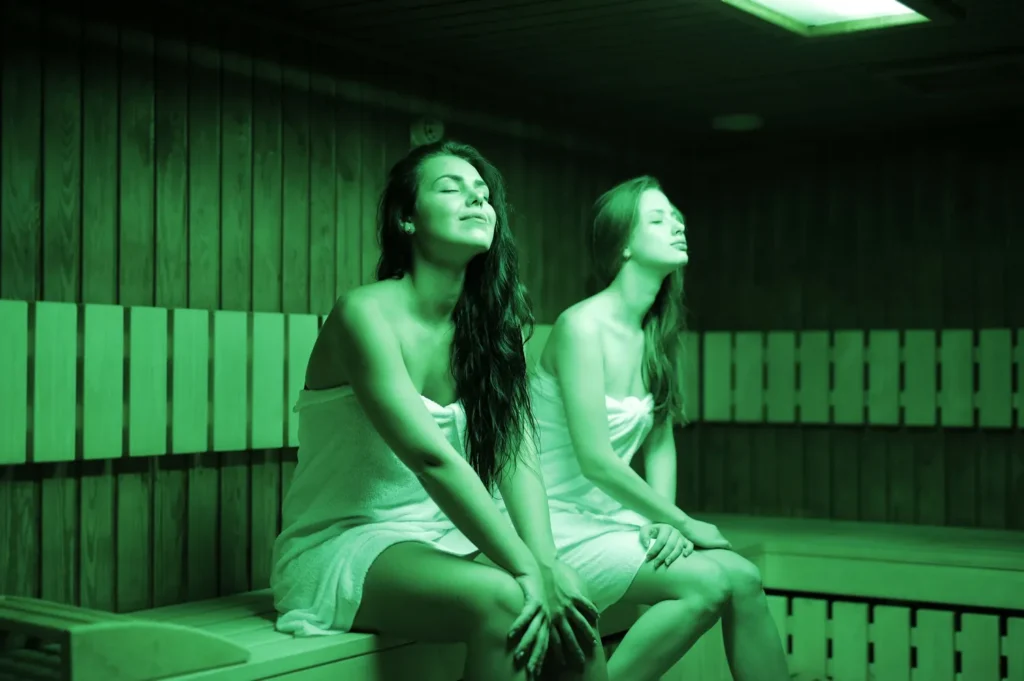 women sitting in a low EMF infrared sauna